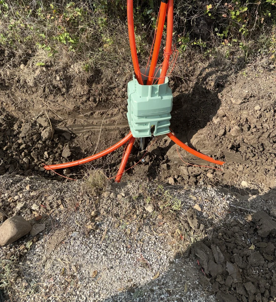 Utility pedestal base and conduit placement along the project route