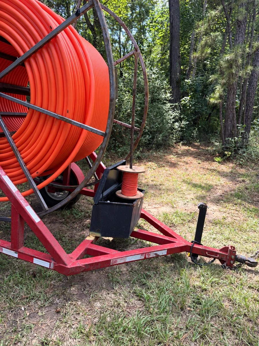 Prepared conduit reel for underground infrastructure placement