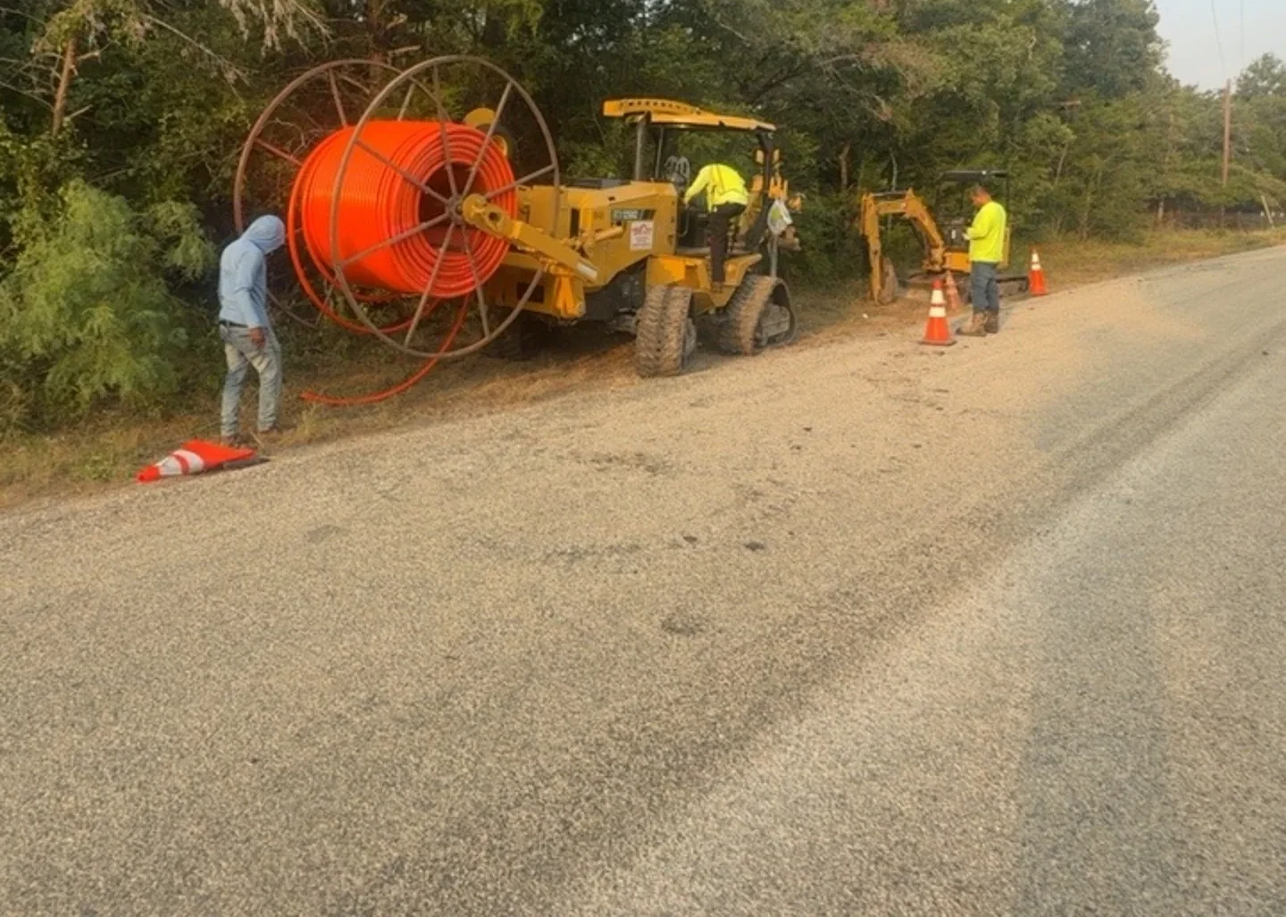 Conduit reel and utility equipment at roadside installation