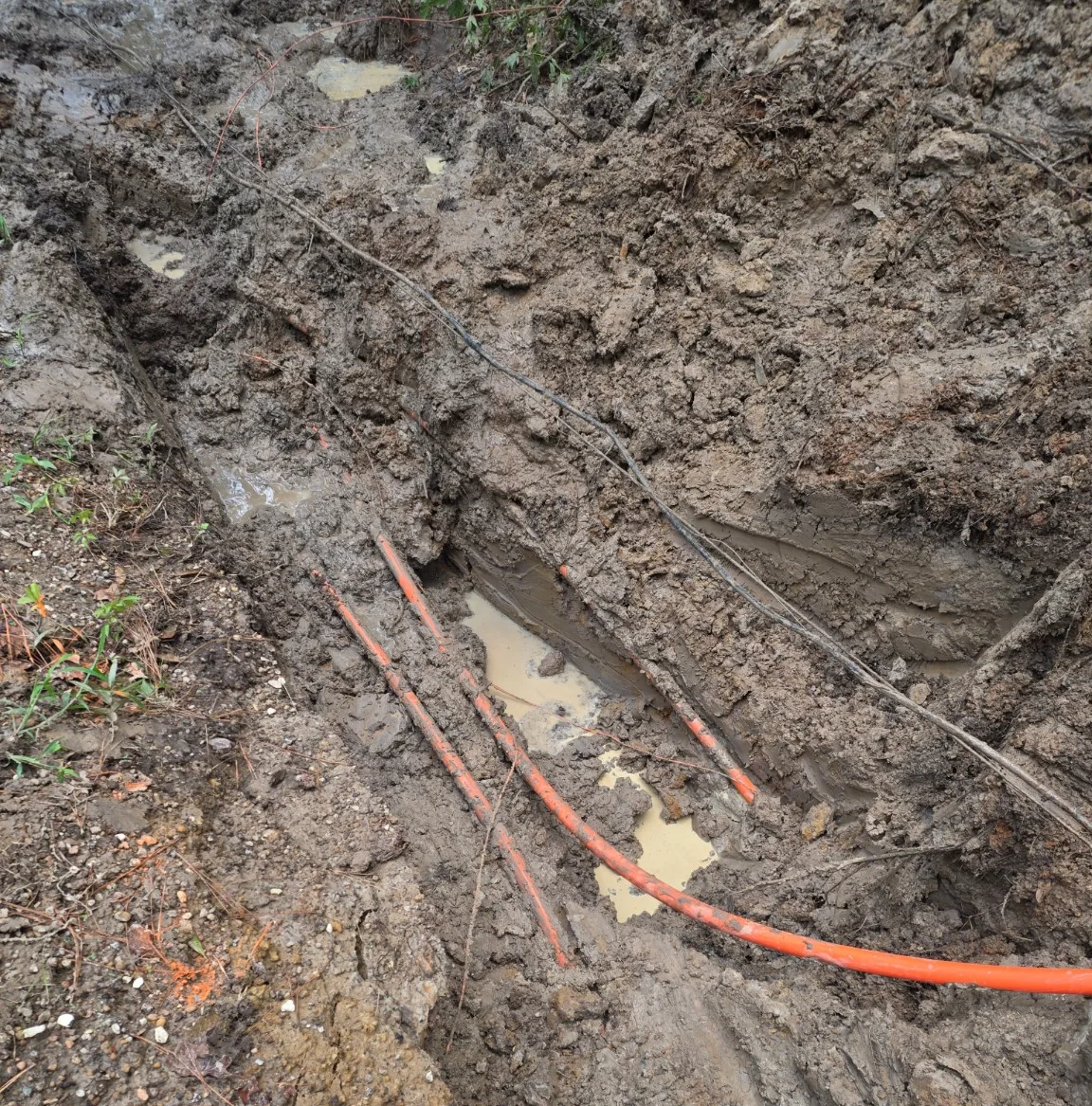 Conduit installed along a prepared trench