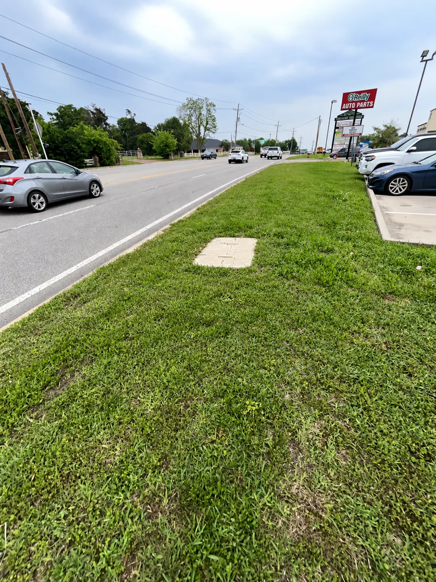 Roadside utility box with completed grass restoration